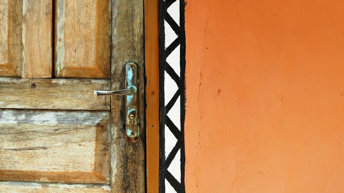 an orange door with a black and white border